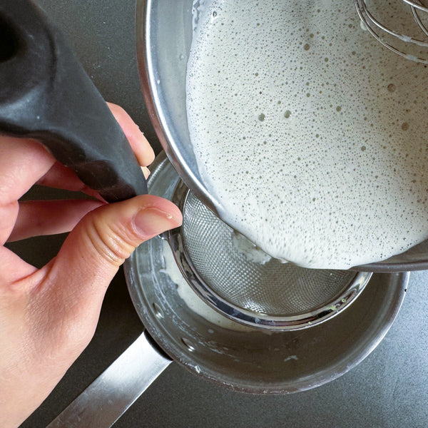 passing the mixture through a sieve