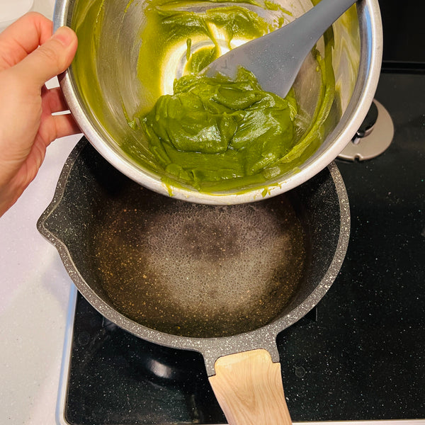 adding the matcha bean paste mixture to the kanten