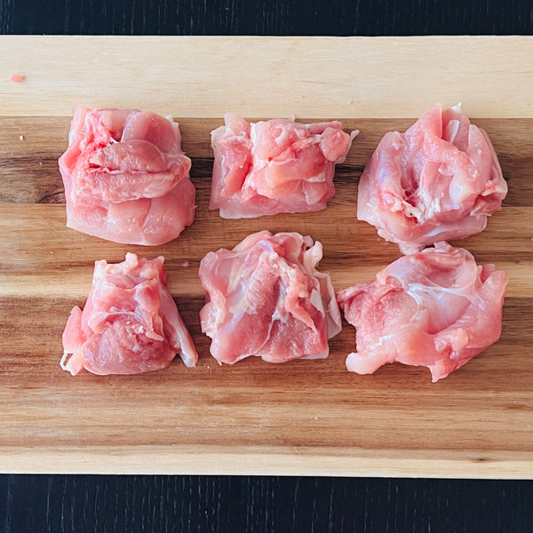 cutting the chicken into smaller pieces