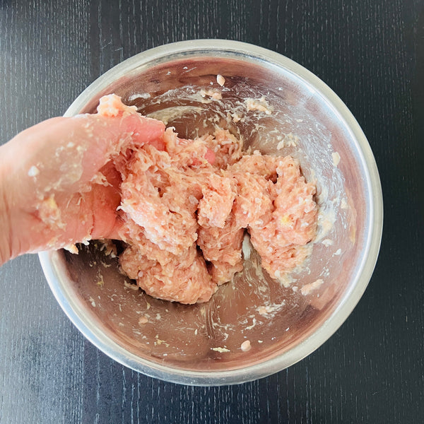 mixing the tsukune ingredients together