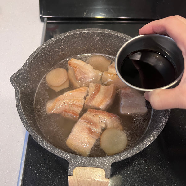 adding soy sauce