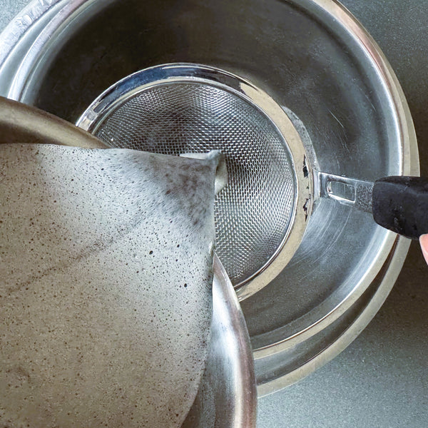 straining the custard mixture one more time