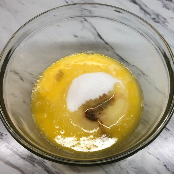 adding the sugar and vanilla extract