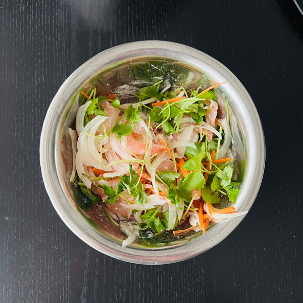 coating the shrimp and vegetables in flour