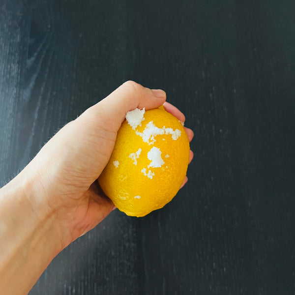 rubbing the lemons with salt