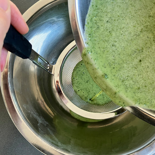 sifting the crepe batter