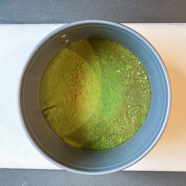 placing the crepes into a cake pan