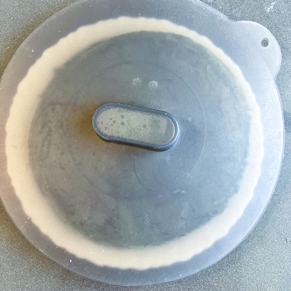 covering the crepes with a lid to prevent them from drying out