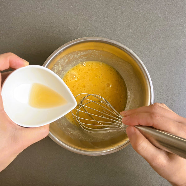 adding rum to the custard