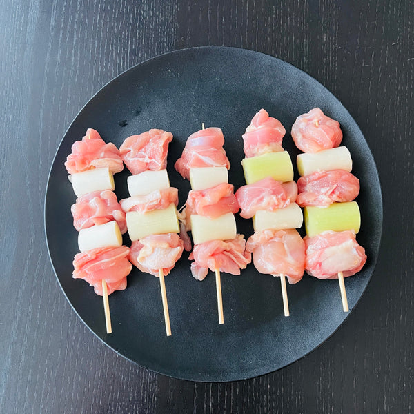 sticking the ingredients onto skewers