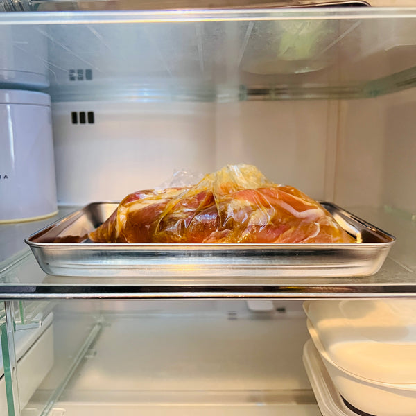 allowing the chicken to marinate in the fridge